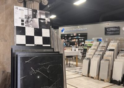 Black and white tile display with a view down the showroom aisle in Evansville IN