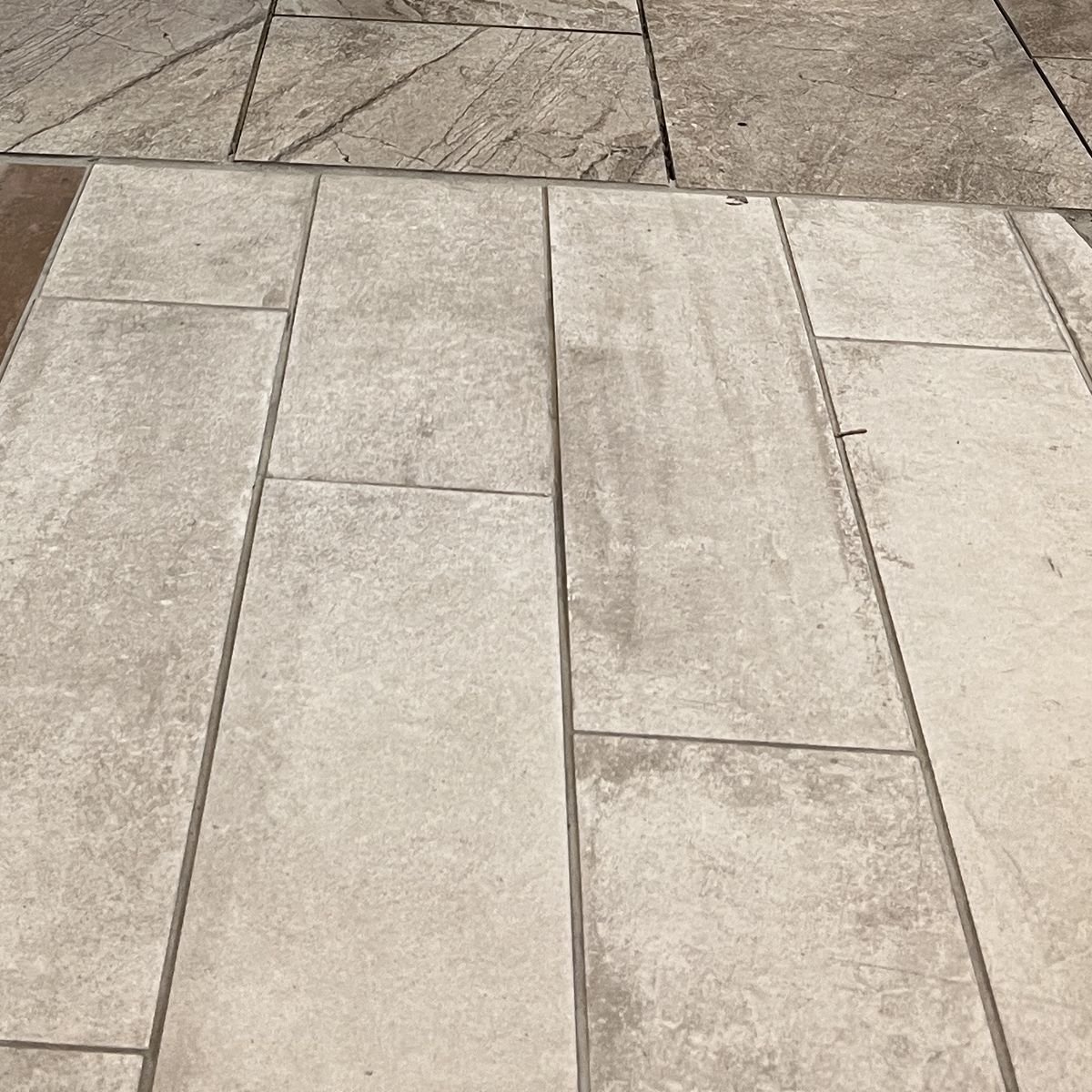 Gray distressed wood look tile floor in the Evansville IN showroom