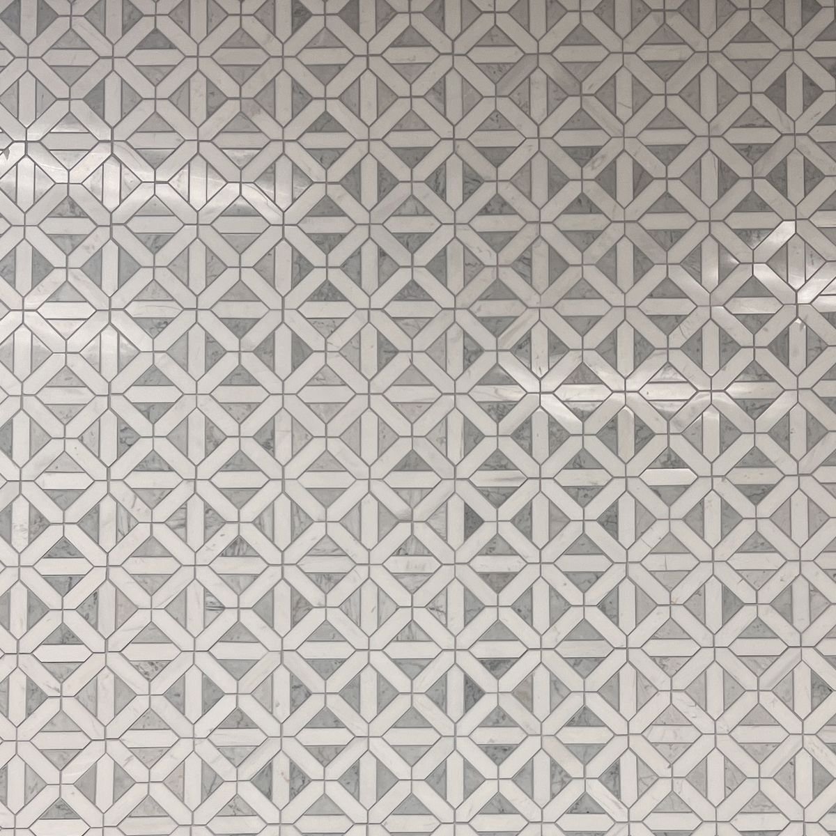 Gray and white geometric marble mosaic backsplash at Evansville Tile Distributors