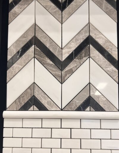 Black, gray, and white marble chevron mosaic with subway tile in Evansville IN