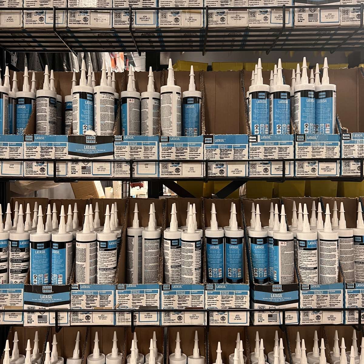 Shelves of tile caulk in stock for contractors at Evansville Tile Distributors