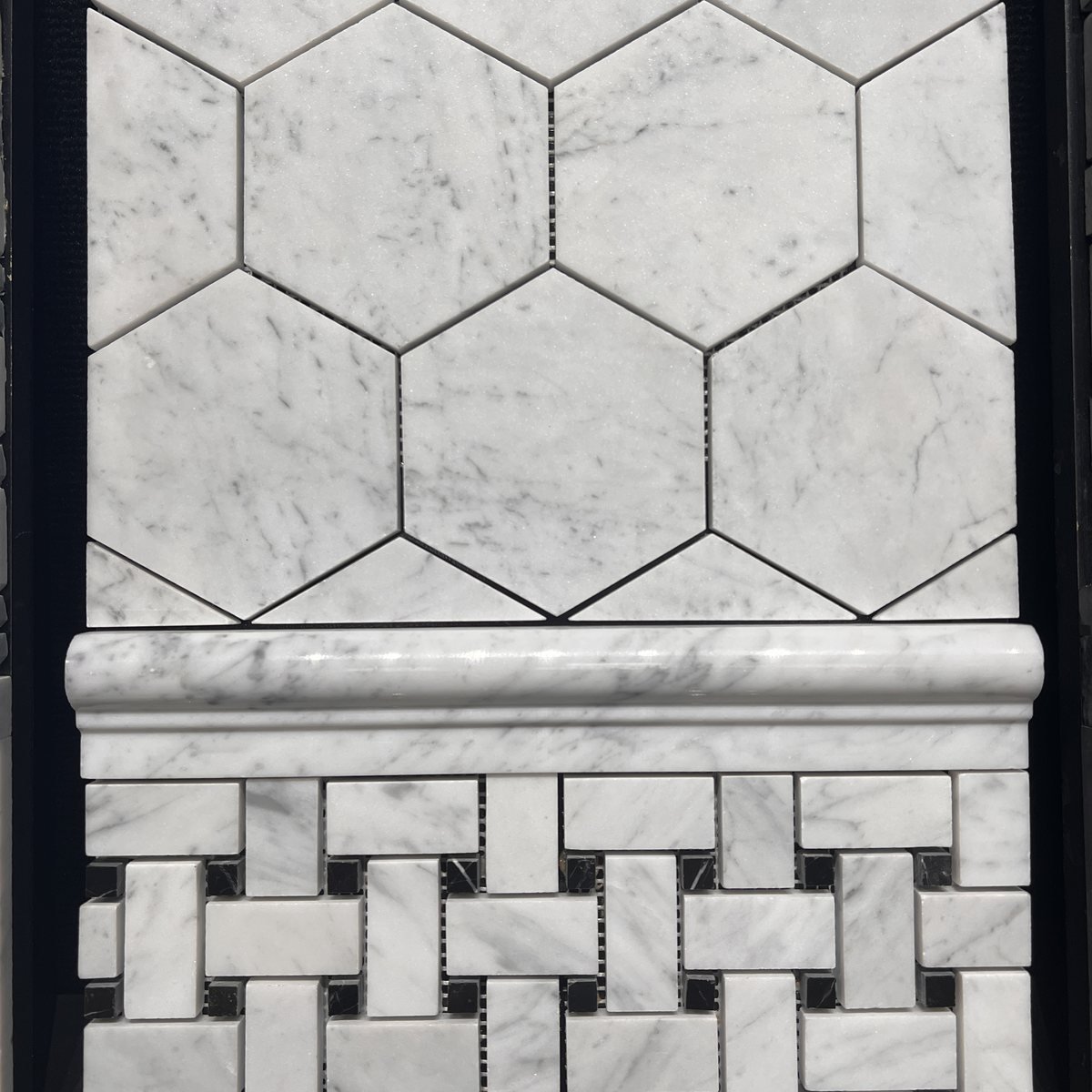 White marble hexagon and basketweave tile display at Evansville Tile Distributors in Evansville IN